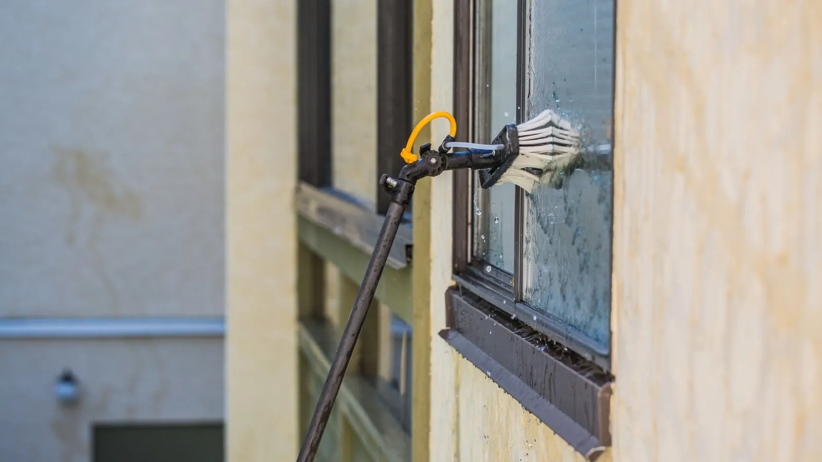 Exterior window cleaning in Wagner SD with brush cleaning equipment